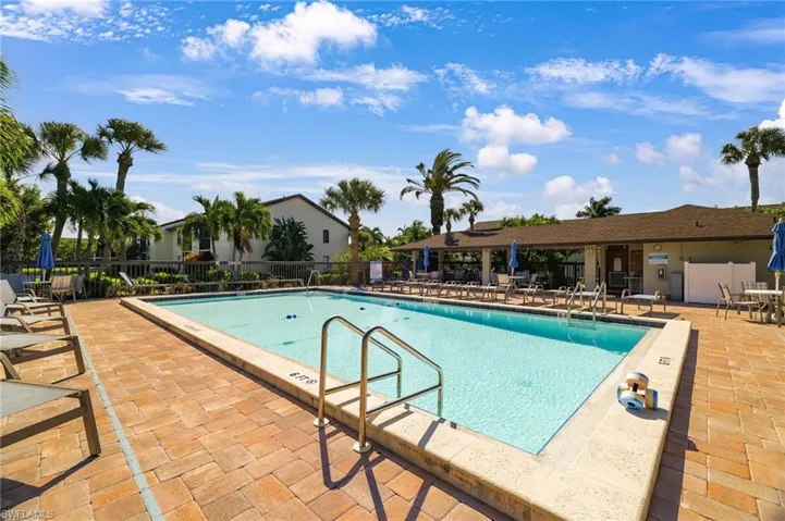 Community pool featuring a patio