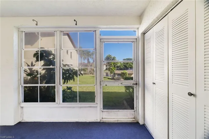 Doorway to outside with carpet floors