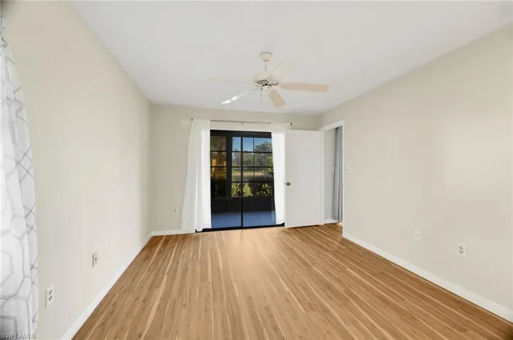 Spare room featuring light wood finished floors and a ceiling fan