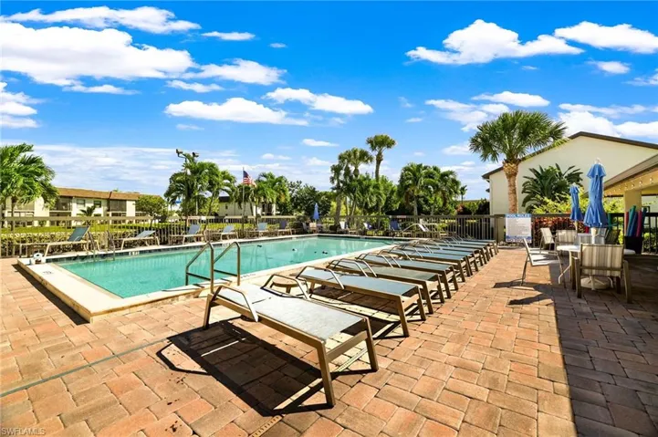 Community pool with a patio area