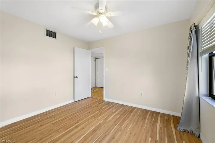 Unfurnished bedroom featuring light wood finished floors and a ceiling fan