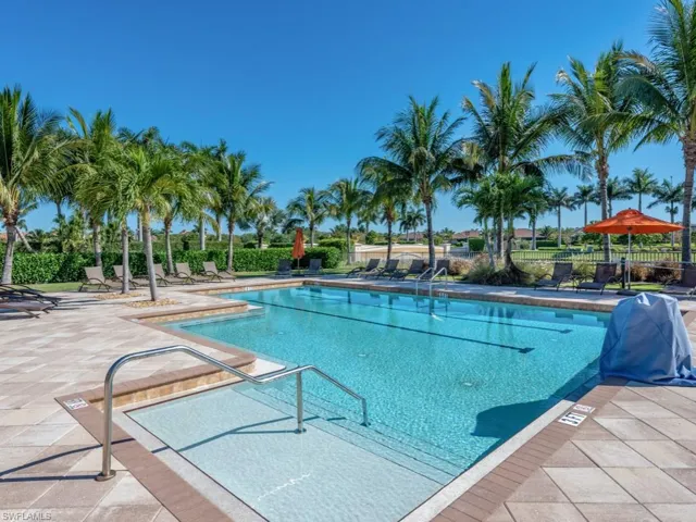 Pool featuring a patio area and fence
