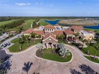Surrounding community featuring a yard, a water view, and golf course view
