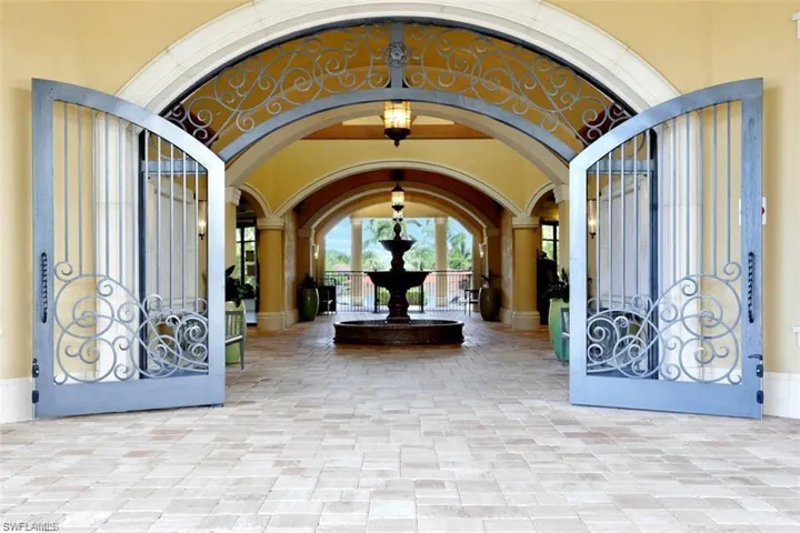 Foyer featuring arched walkways and a towering ceiling