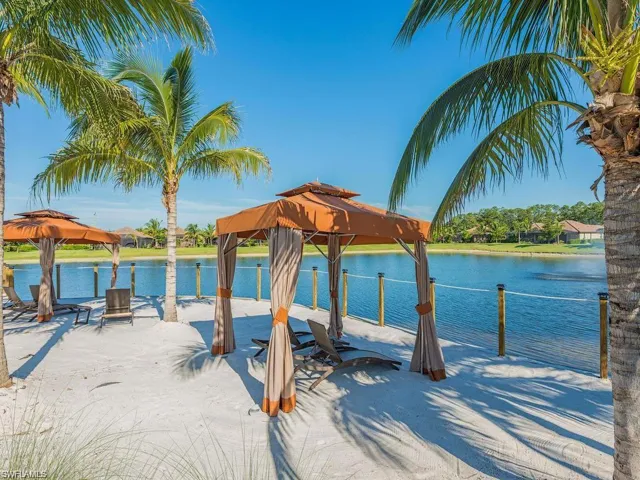 View of dock with a gazebo and a water view