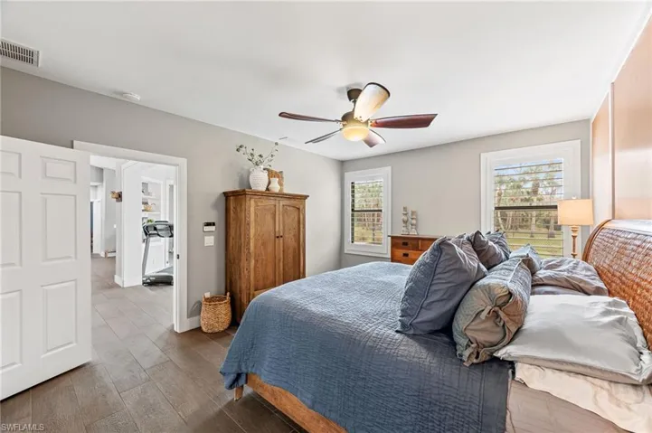 Bedroom with hardwood / wood-style flooring and ceiling fan