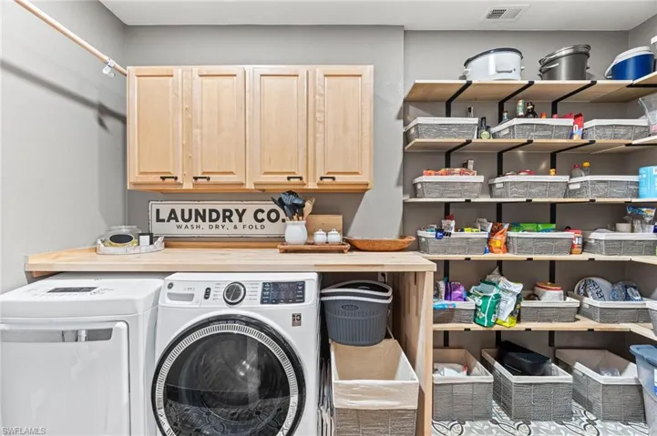 Washroom with washing machine and dryer