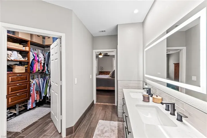 Bathroom with vanity and ceiling fan