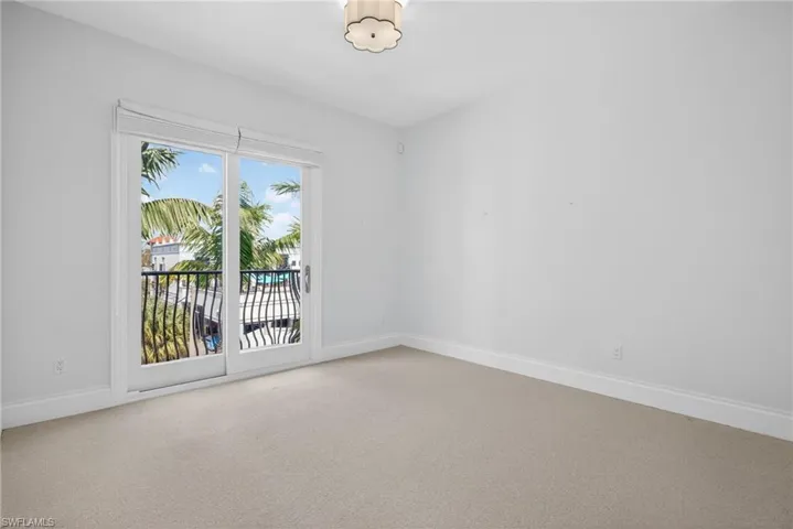 Unfurnished room featuring carpet flooring and baseboards