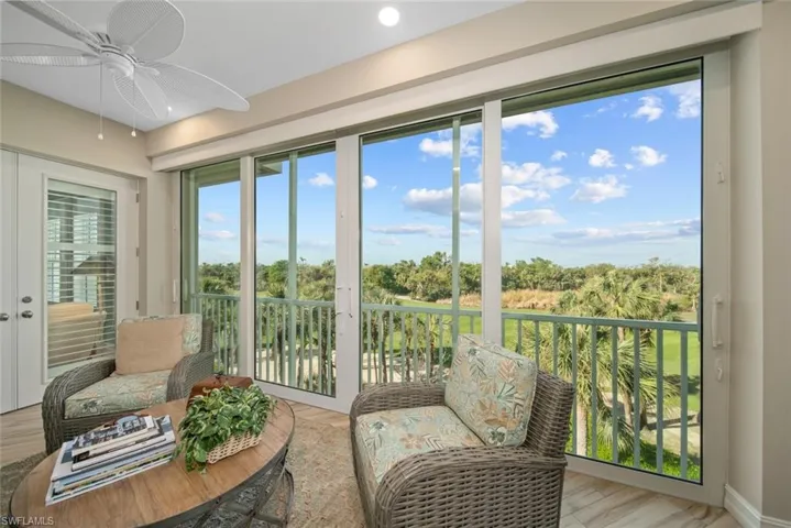 Sunroom featuring ceiling fan