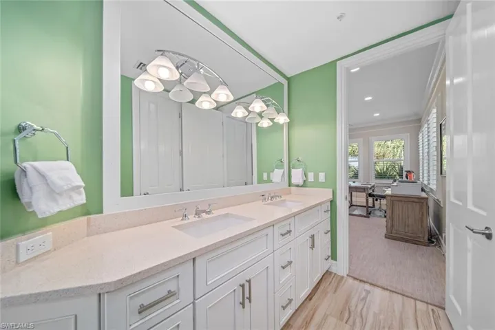 Bathroom featuring hardwood / wood-style floors and vanity