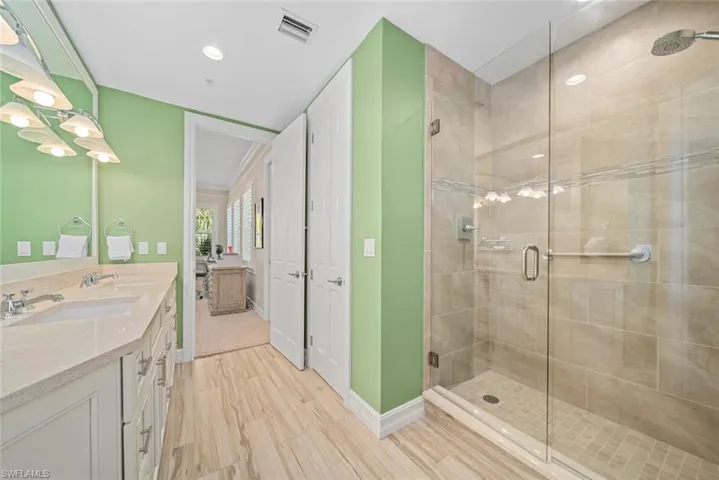 Bathroom with vanity and an enclosed shower