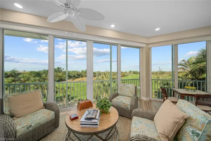 Sunroom / solarium featuring ceiling fan