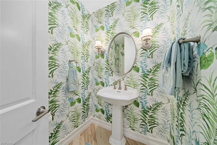 Bathroom with hardwood / wood-style flooring