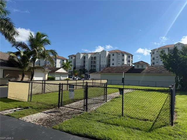 View of property's community with a dog friendly area and a gate