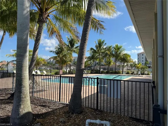 Community pool with a patio