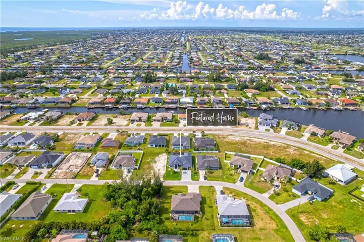 View of property location with nearby suburban area and a nearby body of water