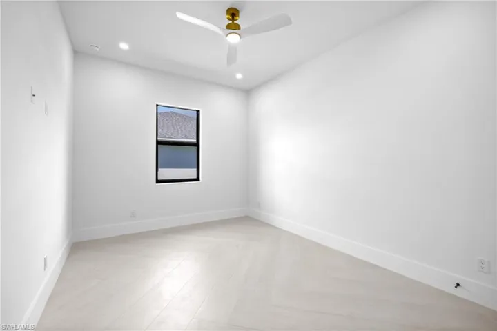 Empty room featuring recessed lighting and ceiling fan