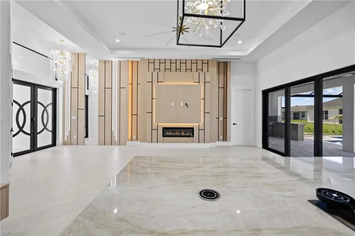 Community lobby with recessed lighting and a towering ceiling