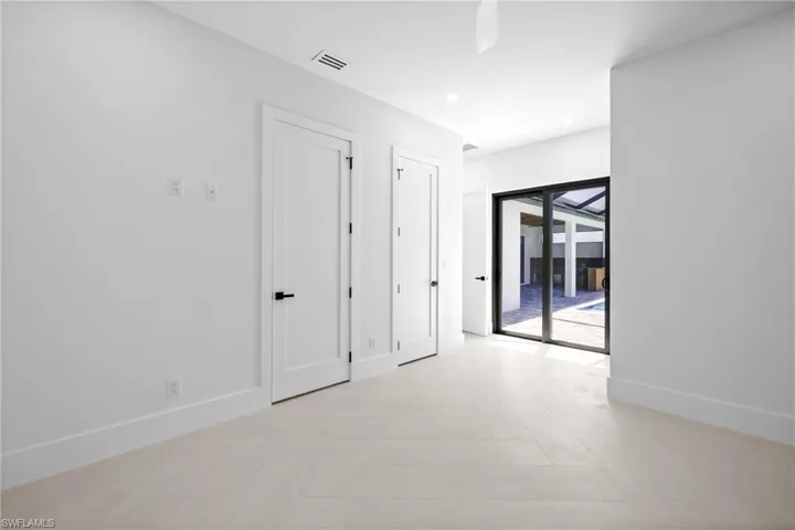 Hallway with recessed lighting and light wood-style floors