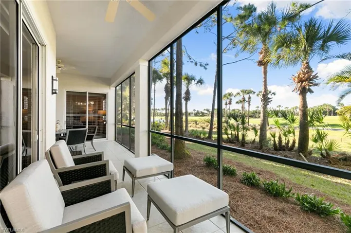 Sunroom with ceiling fan, an outdoor hangout area, and golf course view