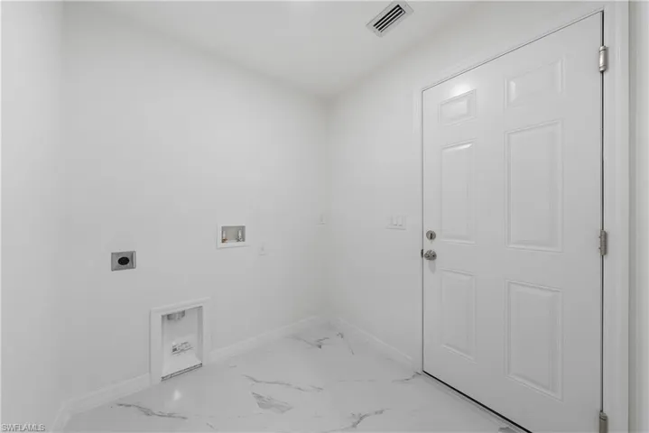 Laundry room with washer hookup and hookup for an electric dryer