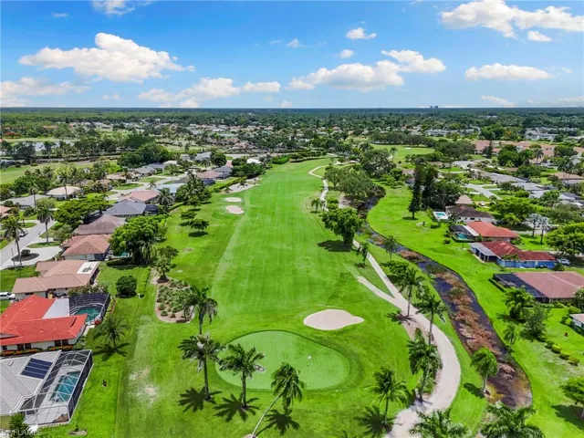 Aerial view of residential area with a local golf course