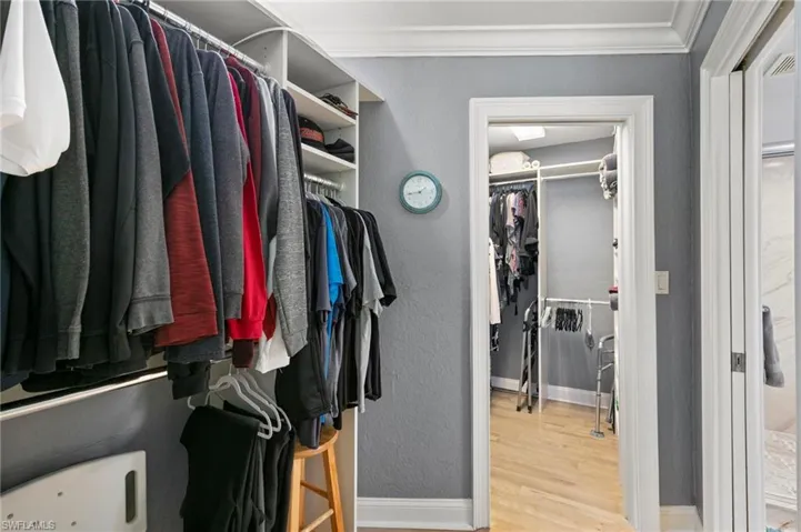 Walk in closet featuring wood finished floors