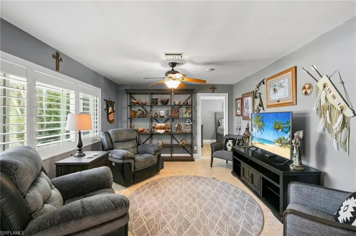 Living room featuring ceiling fan