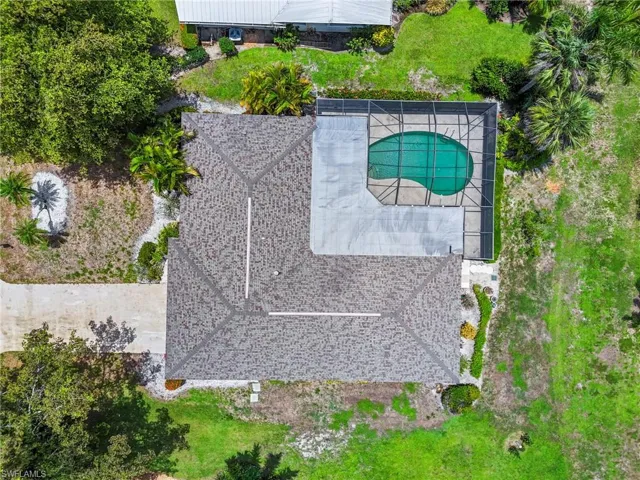 View of subject property featuring a pool