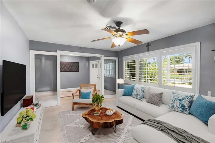 Living area featuring a ceiling fan
