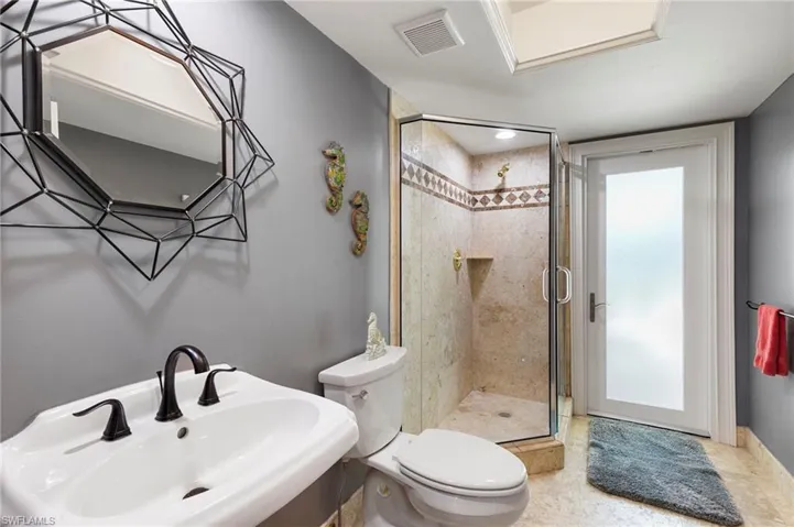 Full bathroom with a sink and a shower stall