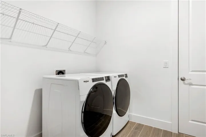 Laundry room with washer and gas dryer