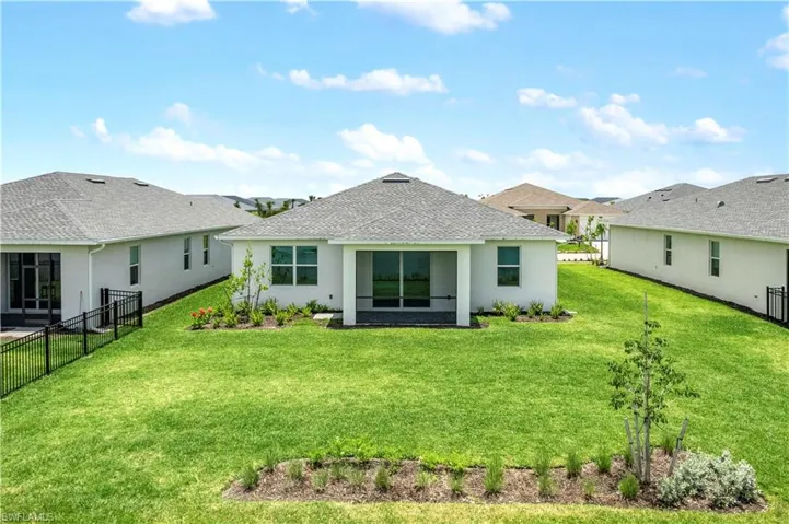 Rear of home with plenty of room for pool after closing