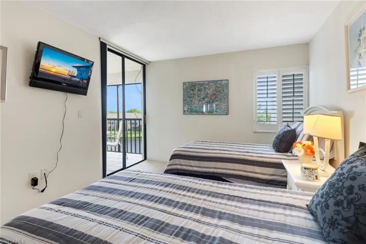 Carpeted bedroom with access to outside
