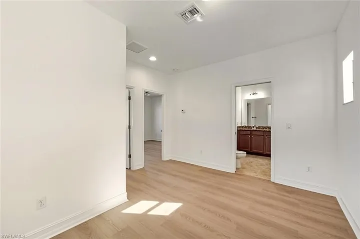 Spare room with light wood-style flooring and recessed lighting