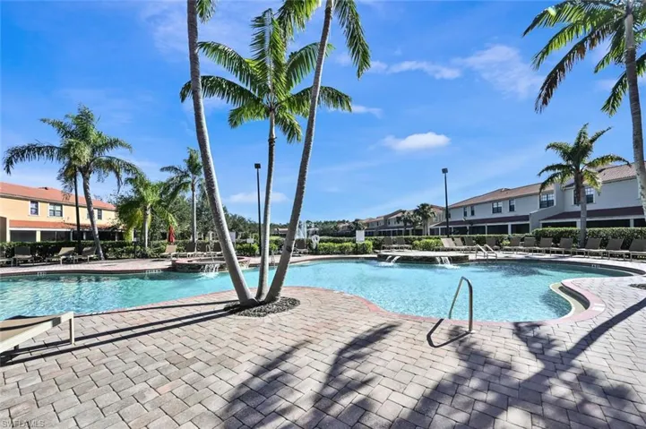 Community pool featuring a patio