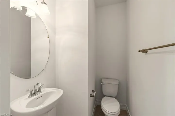 Half bath with a sink and toilet