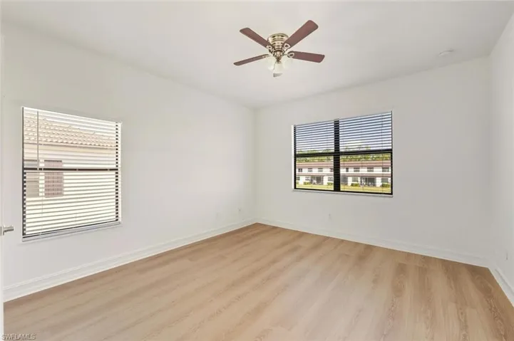 Spare room featuring light wood finished floors and a ceiling fan