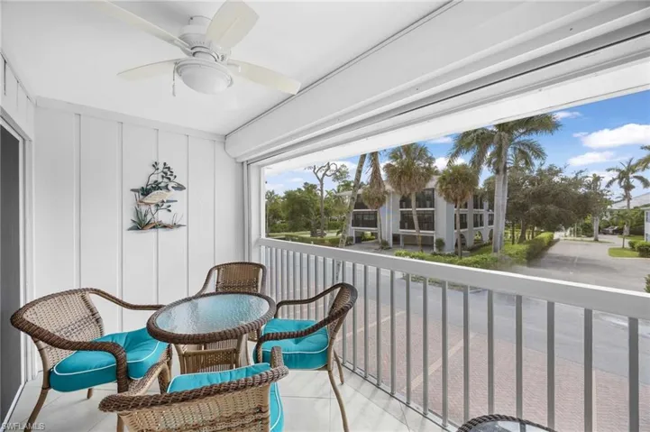 Balcony featuring ceiling fan