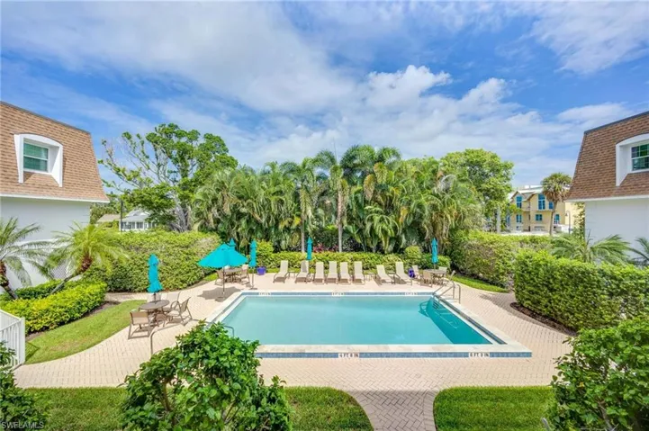 Community pool featuring a patio