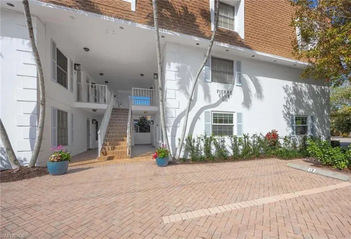 Doorway to property with stucco siding
