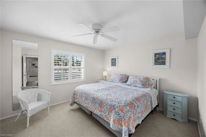 Bedroom featuring carpet and a ceiling fan