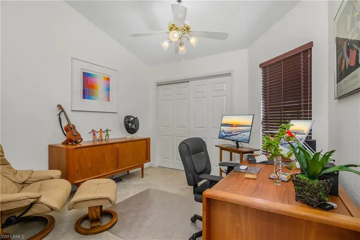 Home office featuring carpet and ceiling fan
