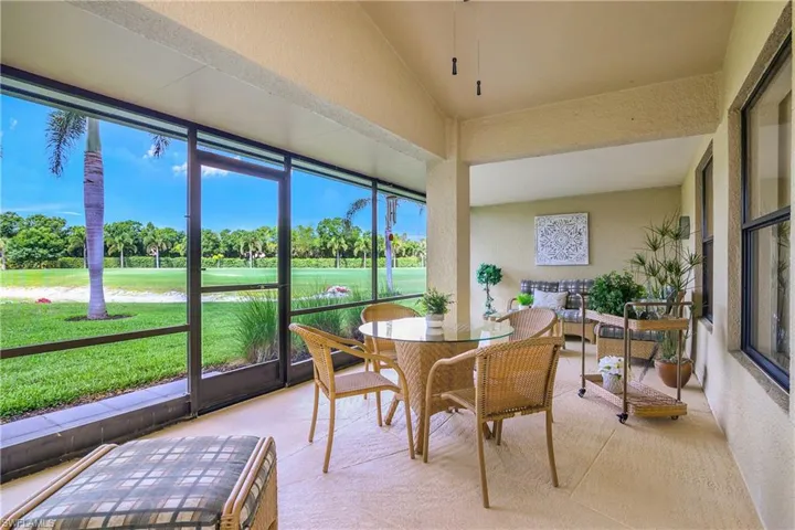 Lanai featuring view of golf course, pond and sunsets