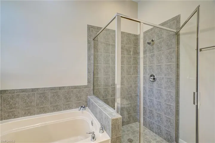 Bathroom featuring plus walk in shower