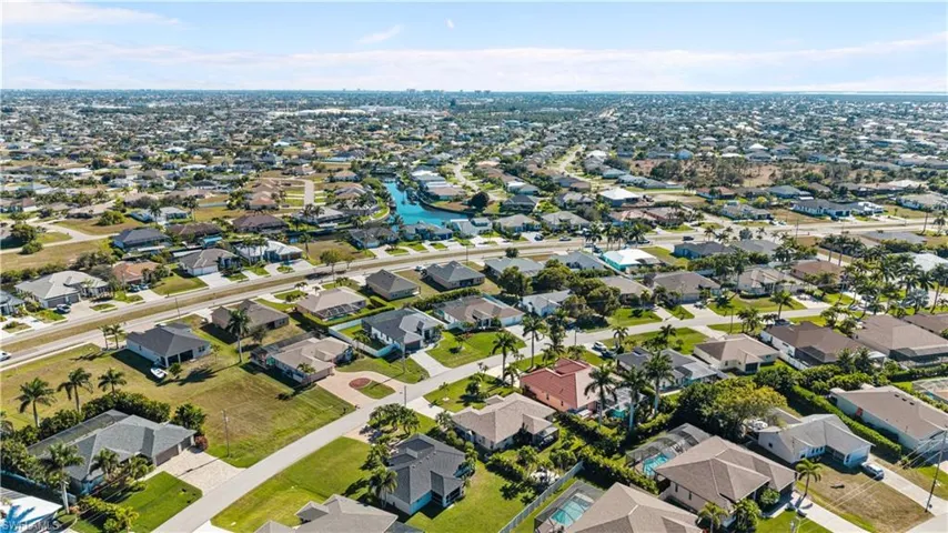 View of property location with nearby suburban area