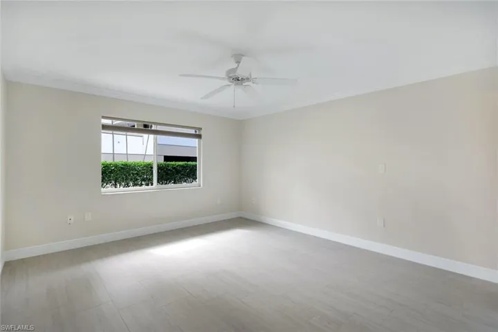 Unfurnished room with crown molding and ceiling fan