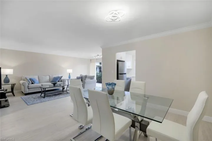 Dining area with crown molding and tile floors