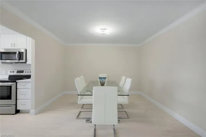 Dining area featuring crown molding